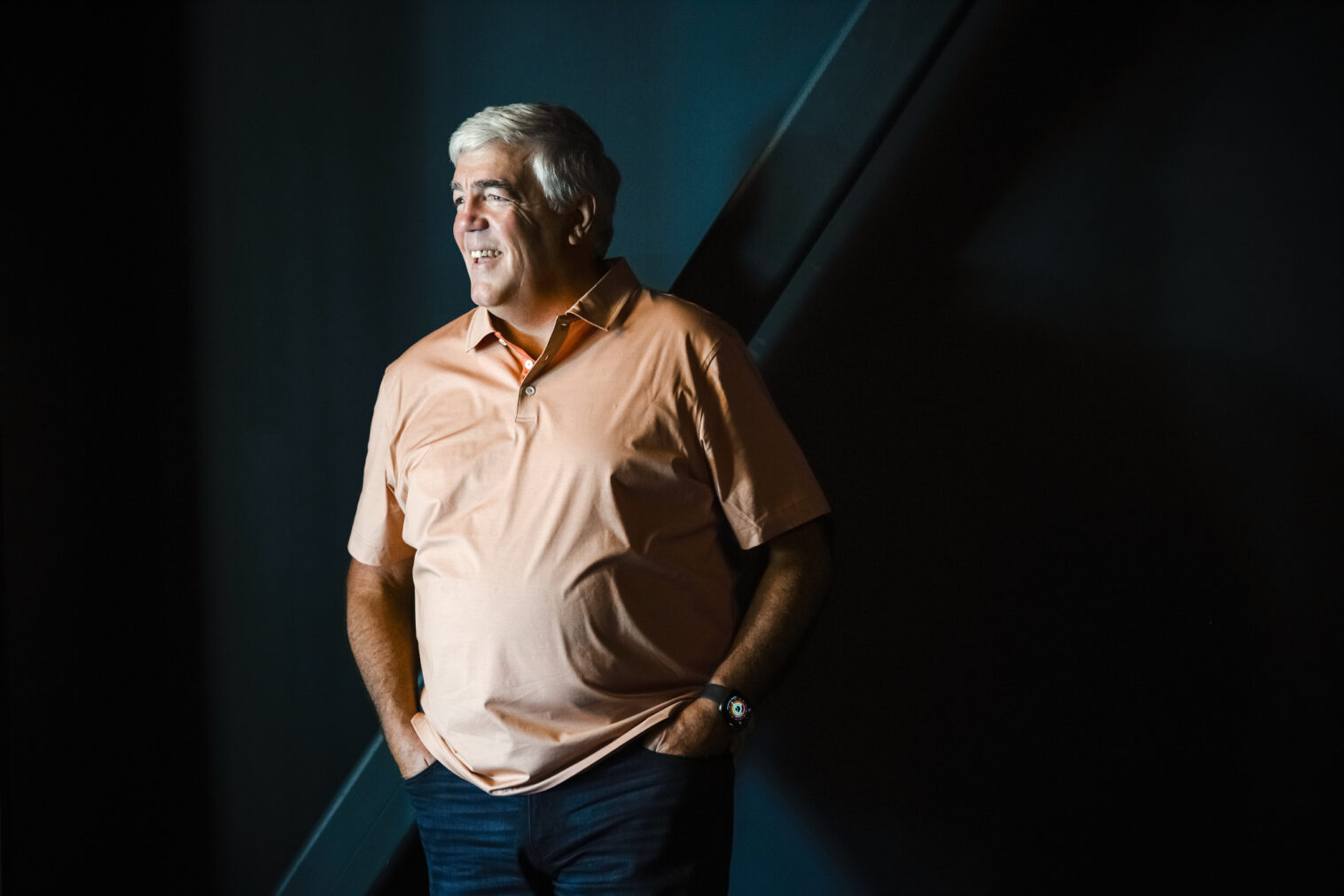 Personal branding portrait of a motivational speaker at a modern coworking space in Chicago.