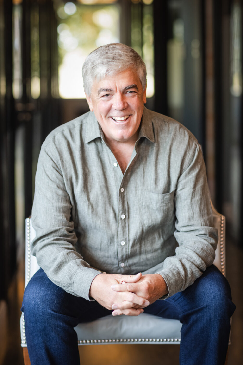 Personal branding portrait of a motivational speaker at a modern coworking space in Chicago.