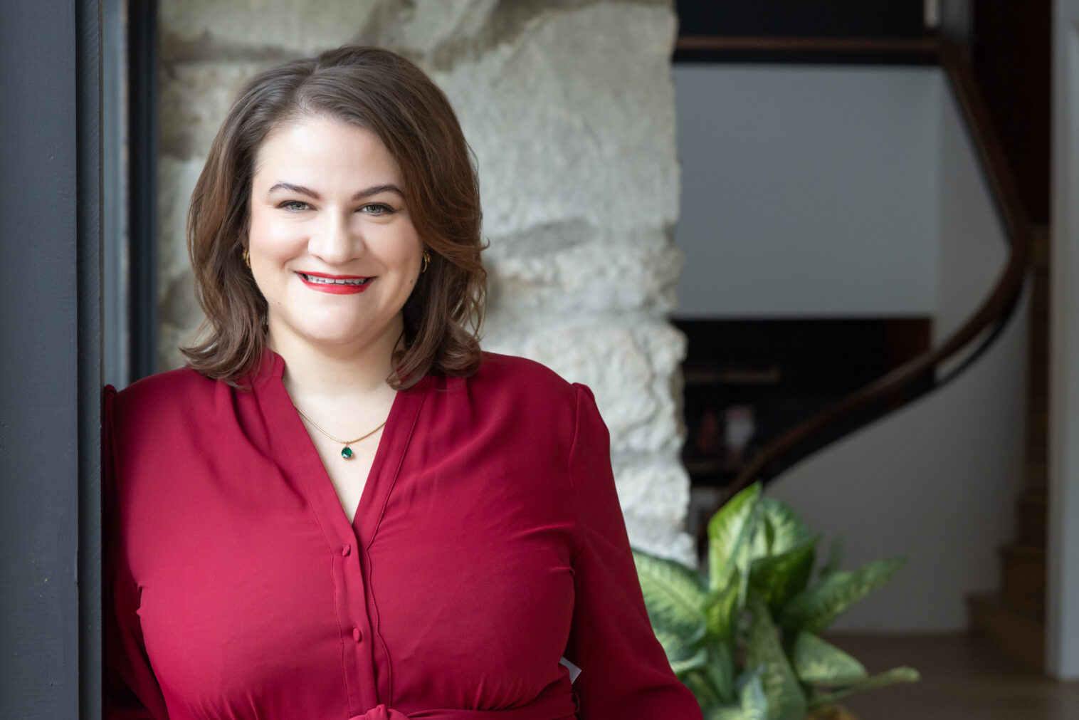 A lifestyle branding portrait for a real estate professional who wanted images that feel warm, confident, and client-ready. Photographed in a bright, modern office environment to convey expertise and a personal connection with buyers and sellers.