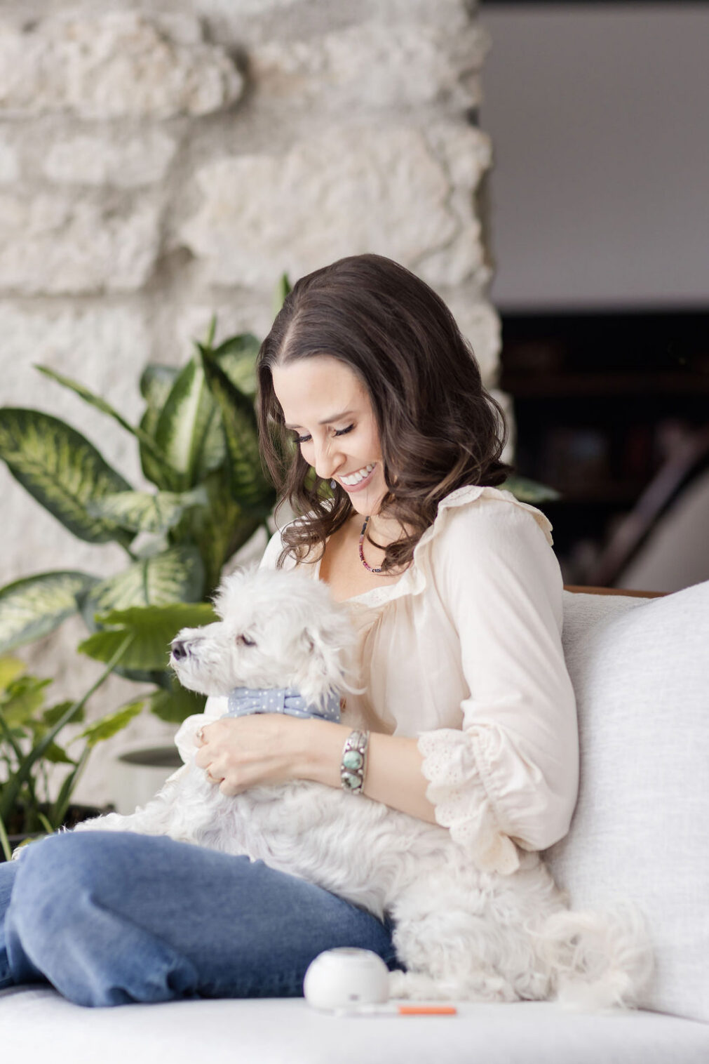 Candid branding photo of wellness coach laughing during photoshoot